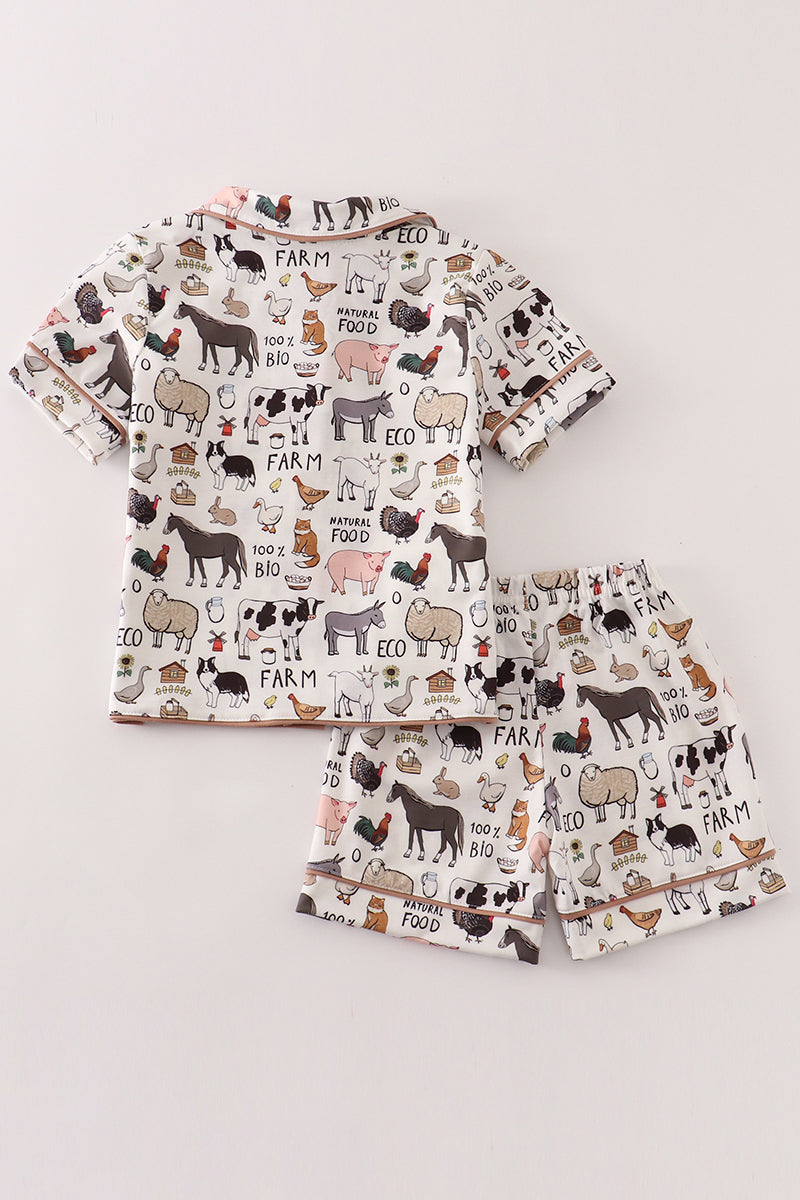 Conjunto de pijama beige para niño de granja