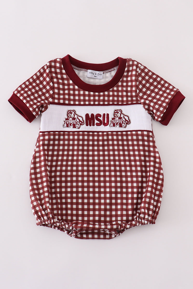 A red and white gingham baby bubble with MSU embroidery and a smocked design.