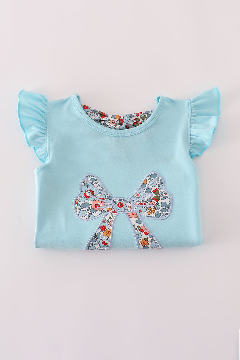 Conjunto de falda pantalón deportiva con aplique de lazo floral azul