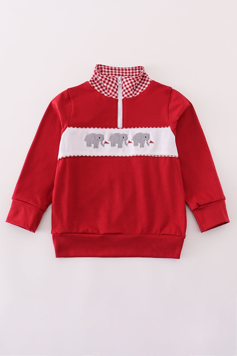 Red sweatshirt with white accents and elephant design on a light gray background