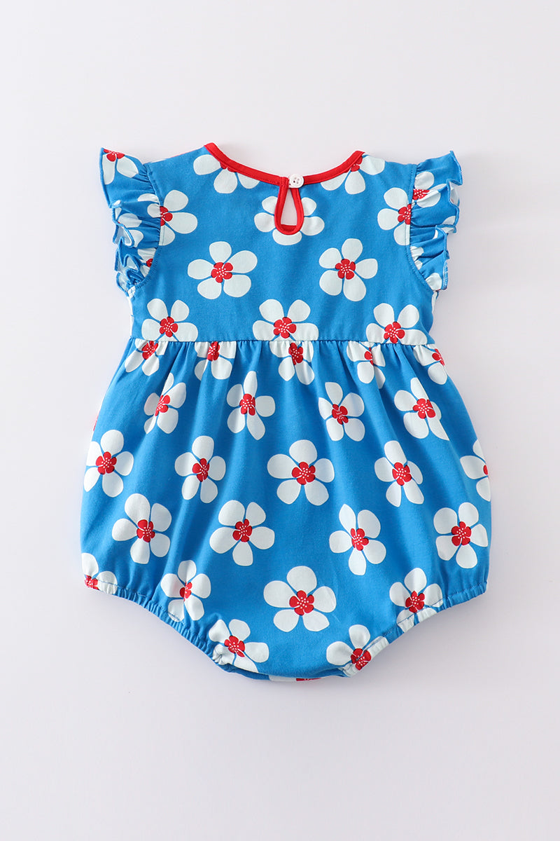 Burbuja con volantes y estampado floral en azul platino y blanco para niña