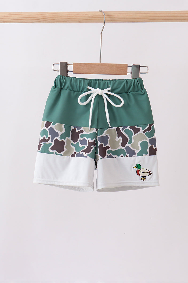 Boutique Children's Camo Duck Embroidery Boys Swim Trunks. A bold camouflage pattern paired with playful duck embroidery detailing delivers the perfect mix of outdoor edge and whimsical charm — conversation-starting swimwear that's as fun as it is functional.
