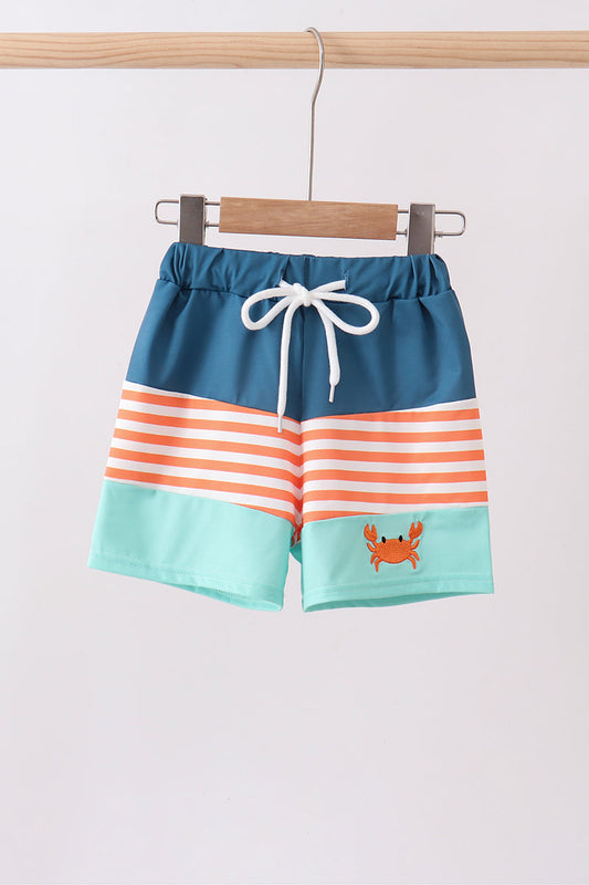 Children's Boutique Crab Embroidery Boys Swim Trunks. Detailed embroidered crab designs, quick-dry fabric, and UPF 50+ sun protection make these trunks the perfect combination of playful personality and summer-ready performance.