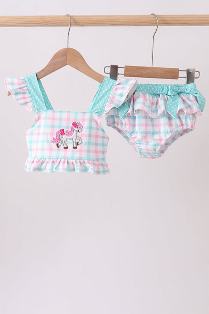Children's boutique clothing. Green Plaid Horse Appliqué 2-Piece Girls Swimsuit. A classic green plaid pattern paired with an adorable horse appliqué detail, a coordinated top and bottom, and UPF 50+ sun protection make this set the perfect blend of preppy personality and summer fun.