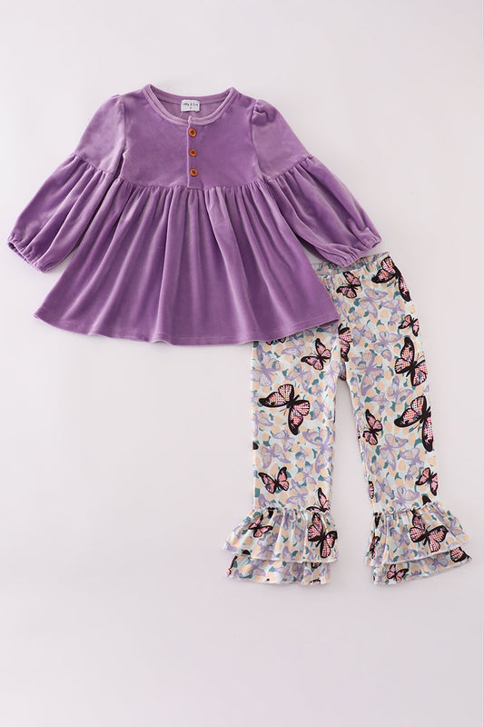 Purple velvet top and butterfly-patterned pants on a white background