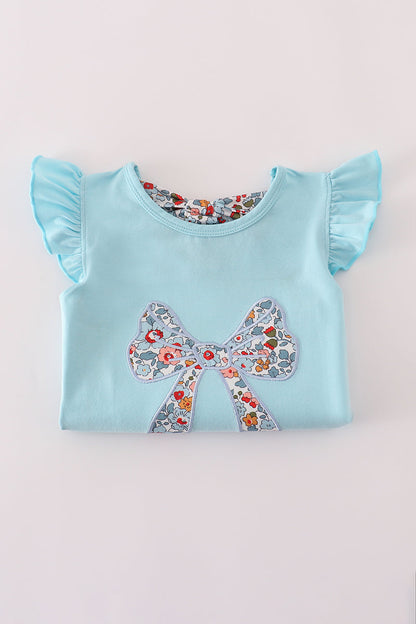 Conjunto de falda pantalón deportiva con aplique de lazo floral azul