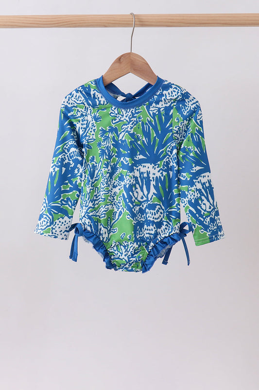 Vibrant ocean garden print — beautiful underwater-inspired graphics that make a splash
UPF 50+ sun protection — blocks 98% of harmful UV rays for safe, carefree play
Stretchy, quick-dry fabric — 88.5% Polyester, 11.5% Spandex that moves with her all day
Chlorine &amp; saltwater resistant — built to last through every swim session
Flatlock seams — smooth, chafe-free comfort for extended wear
Snug, secure fit — stays in place through swimming, surfing, and paddleboarding
Sizes 12M–7 Years — perfect from baby 