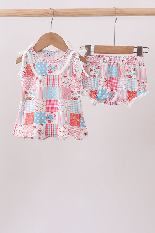 Baby girl boutique outfit. Pink Floral Patchwork Scalloped Bloomer Set. A charming mix of coordinating floral prints in soft pink tones, delicate scalloped edges, and gentle stretch fabric make this set as beautiful as it is comfortable — perfect for playdates, family photos, and every precious everyday moment.