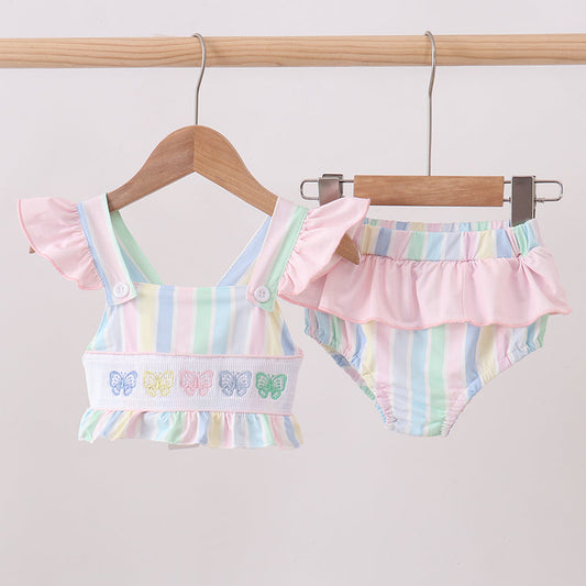 Children's clothing. Rainbow Stripe Butterfly Smocked Ruffle 2-Piece Girls Swimsuit. Vibrant rainbow stripes, delicate butterfly details, a flattering smocked bodice, and playful ruffled trim make this set as joyful and fun as a summer day at the beach