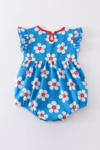Burbuja con volantes y estampado floral en azul platino y blanco para niña